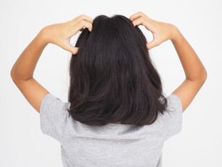 Fototapeta premium Little girl is scratching her head on white background. Closeup photo, blurred.