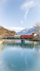 Train crossing a lake in Switzerland