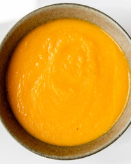 carrot soup on white background close up