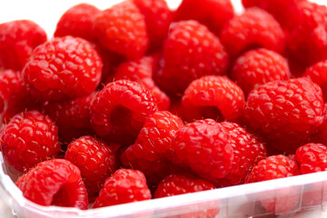 close up fresh raspberries on white background