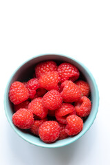 close up fresh raspberries on white background