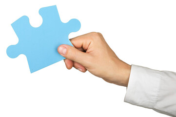 Businessman Hand Holding a Puzzle Piece