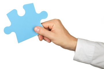 Businessman Hand Holding a Puzzle Piece