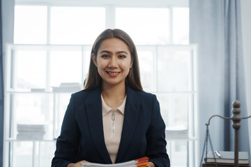 Portrait of female asian lawyer manager in formal suit working with signed insurance contract law, legal, legislation, online consulting real estate clients close deal in realtor office.