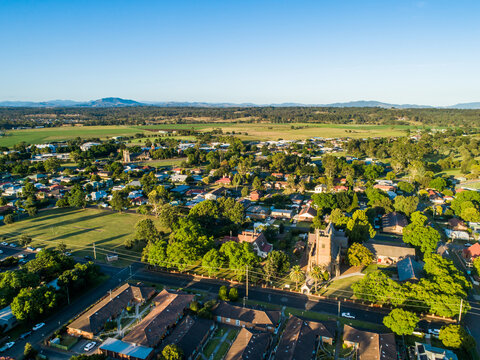 Housing units church and sport field seen from aerial view in Singleton