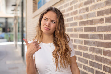 pretty hispanic woman worried, feeling scared, frustrated and stressed