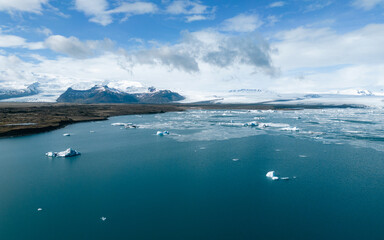 Aerial view of amazing glacier patterns and shapes in Jokulsarlon lake, Iceland. Glacial lagoon with icebergs floating. Climate change, global warming, melting 