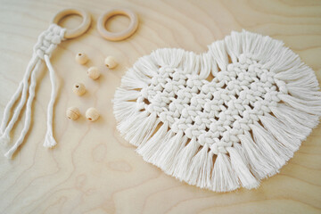 Macrame handmade napkin in the form of heart. Eco diy home decoration. Natural materials, cotton thread. St. Valentine's Day.