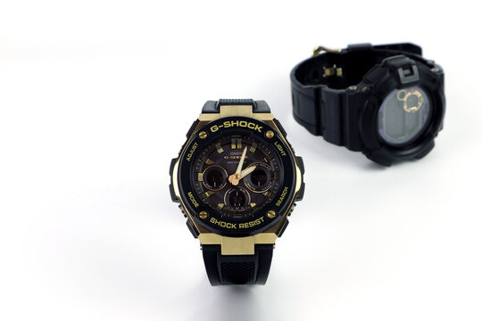 Casio G Shock sports durable and water resistant wrist watch is displayed on white table shelf with background of another casio G Shock watch in watch shop Shinjuku Japan