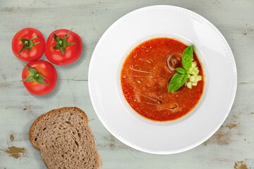 Bowl of hot tasty soup dish on the desk