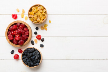 Bowl with different dried fruits on table background, top view. Healthy lifestyle with copy space