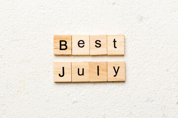 best july word written on wood block. best july text on table, concept