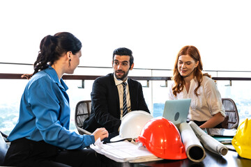 Engineer Construction man and women team working and discussing in office