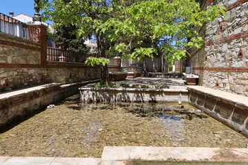 Fototapeta na wymiar Fuenteheridos, Huelva, Spain, April 26, 2023: Water pools where the Murtigas river is born in Fuenteheridos, Huelva, Spain