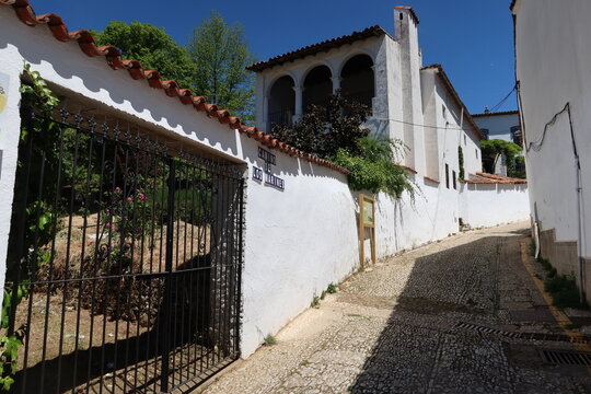 Fuenteheridos, Huelva, Spain, April 26, 2023: Typical cobbled street with white houses of Fuenteheridos, Huelva, Spain