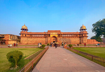 The famous red fort in the city of Agra, India. Tourists visit a popular tourist attraction.