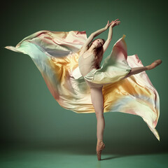 Portrait of beautiful ballerina, dancer wearing colorful dress over dark green background. Contemporary dance. Graceful jump