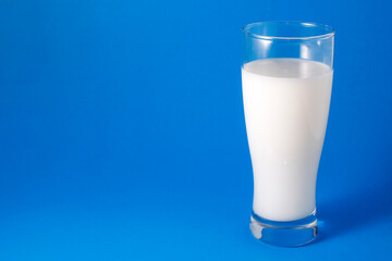 Photo of milk in a large glass.