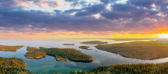 Karelia sunset. Russia landscape. Ladoga lake. Karelian islands. Sunset over coniferous forest. Lakes of Karelia. Many islands view from quadcopter. Taiga in Russia. Karelia panoramic landscape