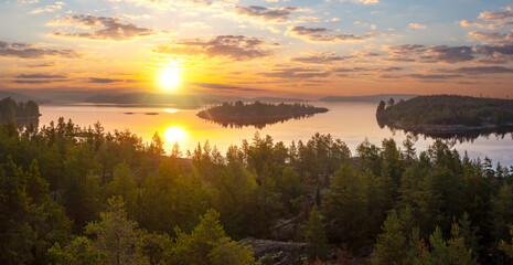 Karelia sunset. Russia landscape. Ladoga lake. Forest on river bank. Karelian isthmus. Sunset over Ladoga. Islands of Karelia. Nature of Russia. Karelia view from quadrocopter. Russian federation - obrazy, fototapety, plakaty