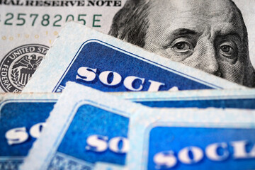 Social Security Cards with US One Hundred Dollar Bill $100