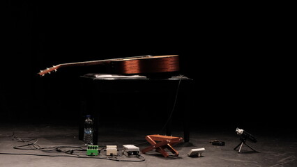 acoustic guitar in the spotlight