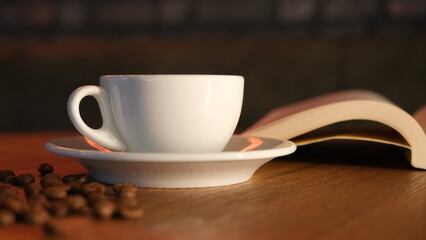 coffee grains, hot coffee and book concept