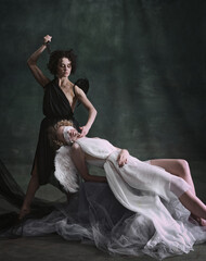 Obsession. Portrait of woman, queen of hell killing sleeping, tender angel. Models posing against...