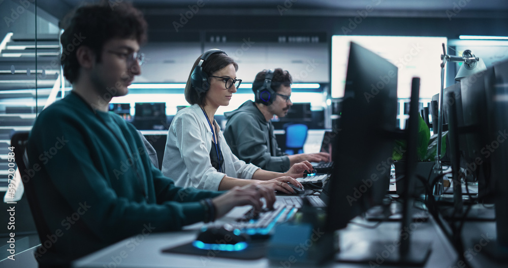 Poster Team of Diverse Multiethnic Software Developers Working on Computers, Developing Artificial Intelligence Projects. Specialist Putting On Headphones. Focus Switching to Another Creative Colleague