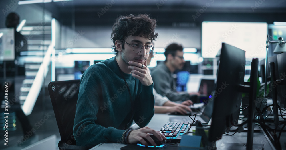 Aufkleber Portrait of a Thoughtful Engineer Working on Desktop Computer in a Technological Office Environment. Research and Development Department Writing Software Code for an Innovative Internet Project