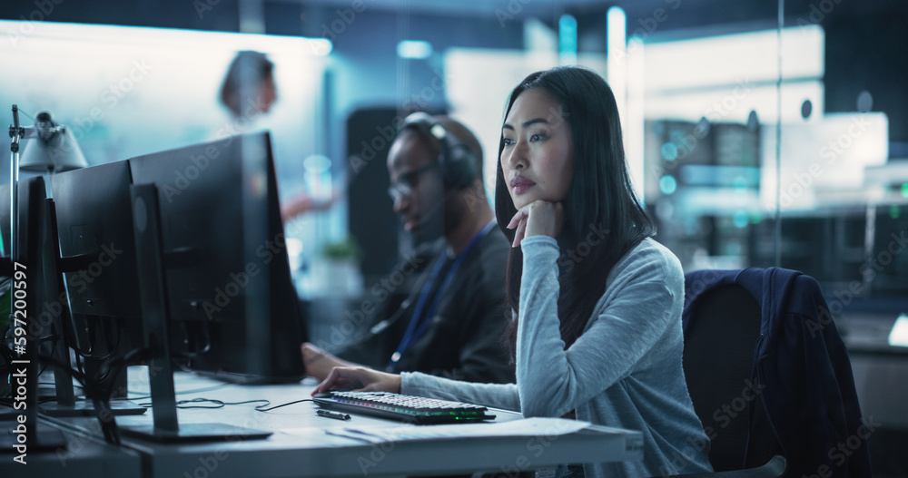 Aufkleber Portrait of a Thoughtful Asian Engineer Working on Computer in a Technological Corporate Laboratory. Young Woman Writing Software Code for an Innovative Internet and Software as a Service Project