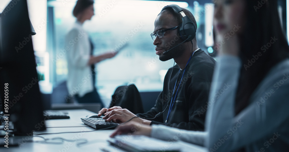 Aufkleber portrait of a smart african young specialist working in a technological startup help desk department