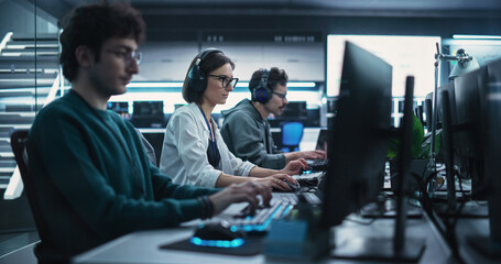 Team of Diverse Multiethnic Software Developers Working on Computers, Developing Artificial Intelligence Projects. Specialist Putting On Headphones. Focus Switching to Another Creative Colleague