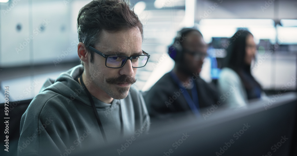 Fototapete Close Up of a Software Developer Working on a Computer, Typing Programming Code on a Stylish Keyboard with Neon Backlight. Professional Employee Doing Work in a Cyber Security Technology Company