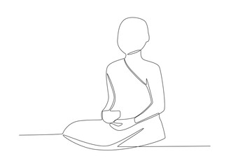 A monk sits doing rituals. Monk one-line drawing