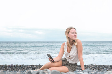 Travel. The girl travels the seas, waterfalls of wildlife. Unity, mental health, eco travel. Camping near the sea, travel, good times, digital detox