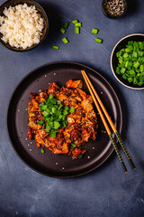 Fried kimchi with pork onions and spices. Traditional Korean food