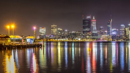 Long exposure Perth City scape nighttime from the harbour view, night light panorama photography in low light.