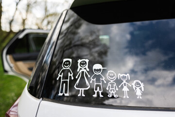 Happy family on board. Sticker on the back of car. Four kids.