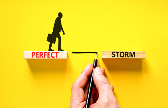 Perfect storm symbol. Concept words Perfect storm on beautiful wooden block. Beautiful yellow table yellow background. Businessman hand. Businessman icon. Business Perfect storm concept. Copy space.
