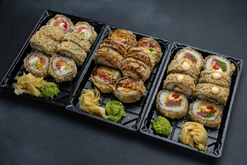 delicious japanese food from chef on black background. Delivery

