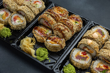 delicious japanese food from chef on black background. Delivery
