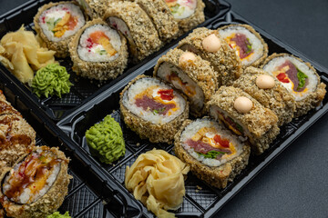 delicious japanese food from chef on black background. Delivery
