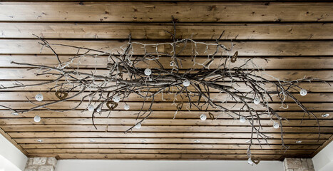 Beautiful home made diy wood creation with lamps on a wooden ceiling.