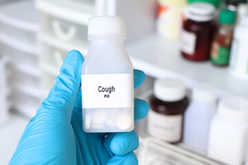 cough pill in white bottle, pill stock