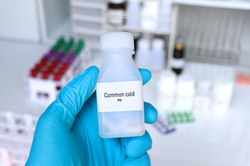 Common cold pill in white bottle, pill stock