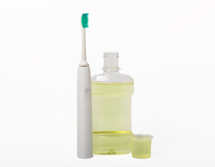 Electric toothbrush, toothpaste, mouthwash, dental floss and tongue cleaner isolated on white...