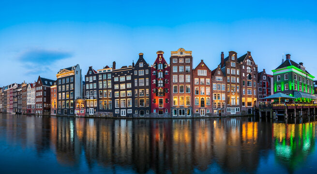 Typical Dutch houses in Amsterdam at dusk. Holland