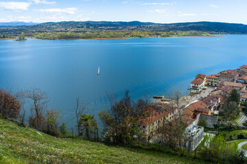 View from the hill on Lake Maggiore, sailboats and mountains