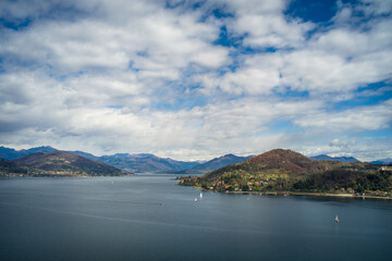View from the hill on Lake Maggiore, sailboats and mountains